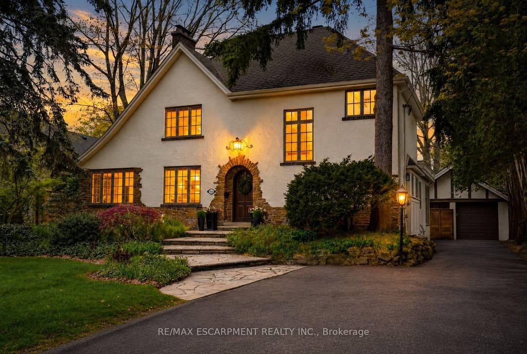Tucked in the heart of Burlington's sought after Old Roseland, this impressive Tudor home offers exceptional space and refined luxury for family living.