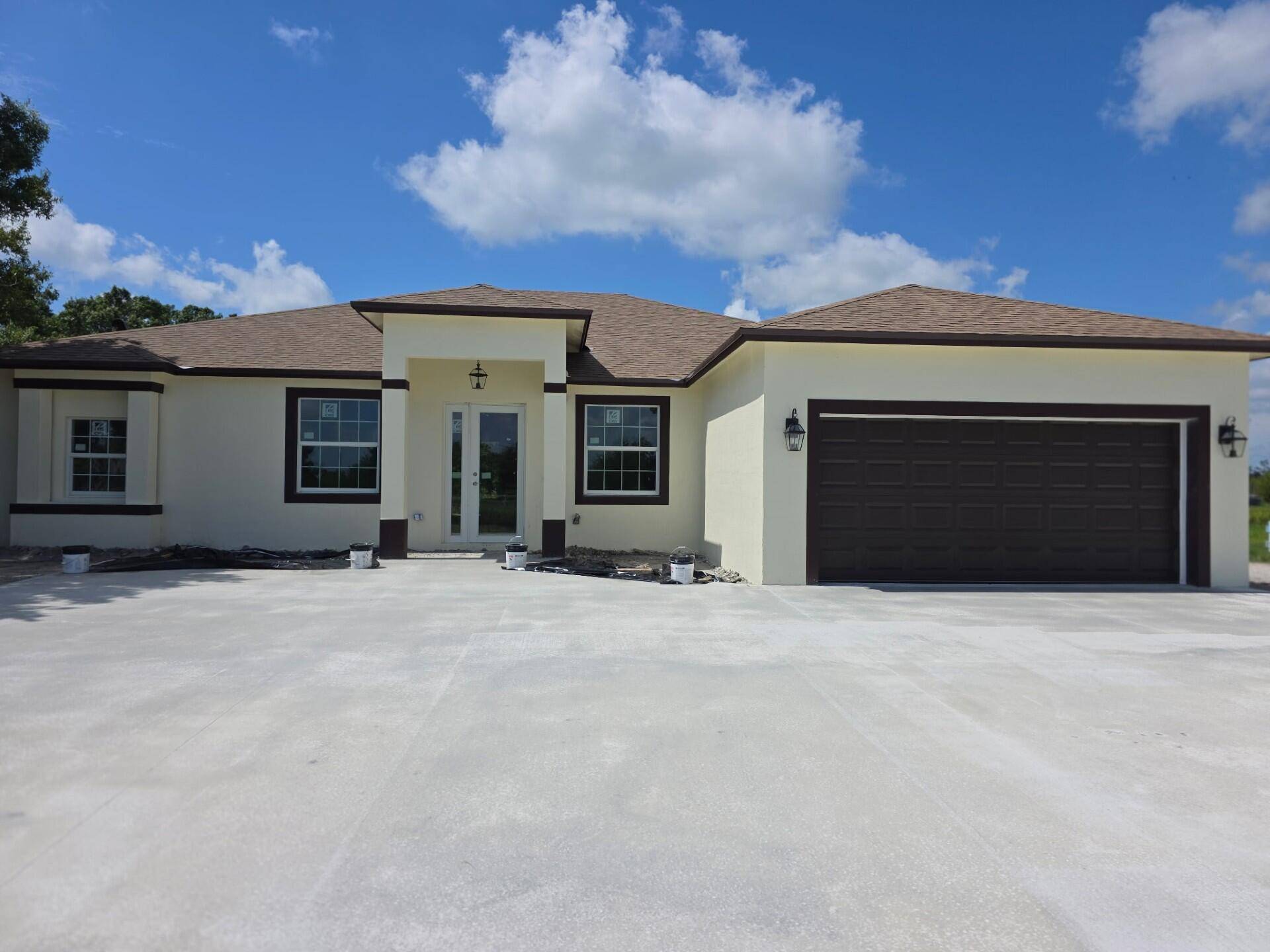 Home is almost finished. As you enter the columned entrance the home features an open floor plan with porcelain tile flooring throughout.