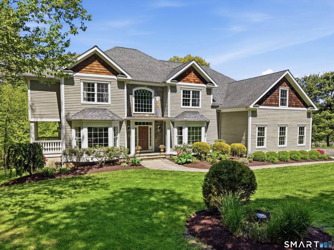 Set on 3 private acres in the heart of central Easton, this impressive Colonial offers over 5, 000 square feet of living space with 5 bedrooms and 6 bathrooms.