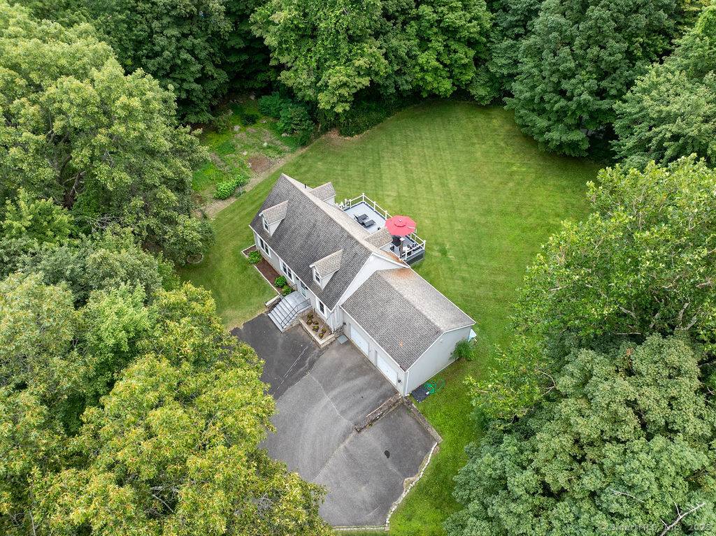 Quintessential New England Cape nestled on an incredibly private 3 acre lot.