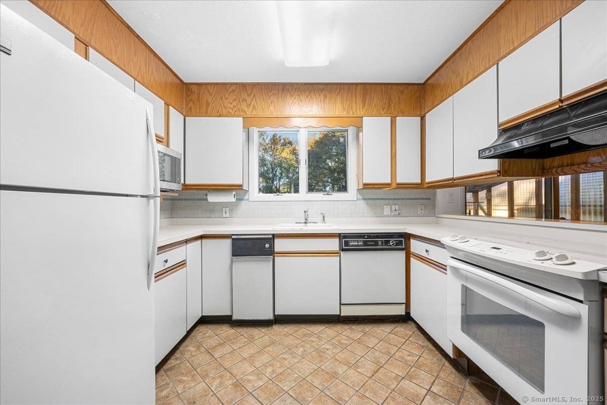 Nestled on a private piece of land surrounded by mature trees, 1399 Route 163 in Montville offers the perfect blend of comfort and tranquility.