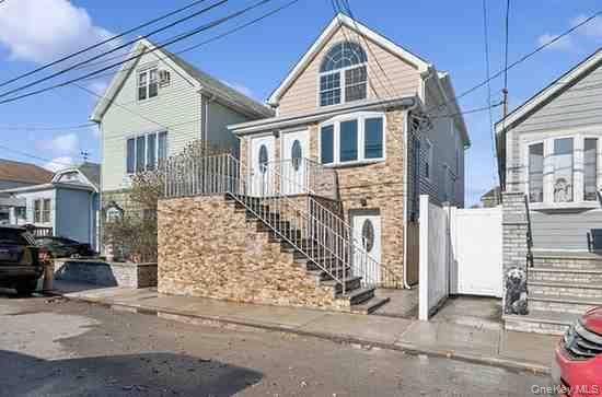 Welcome to this beautifully maintained three family home in the desirable Hamilton Beach section of Howard Beach !
