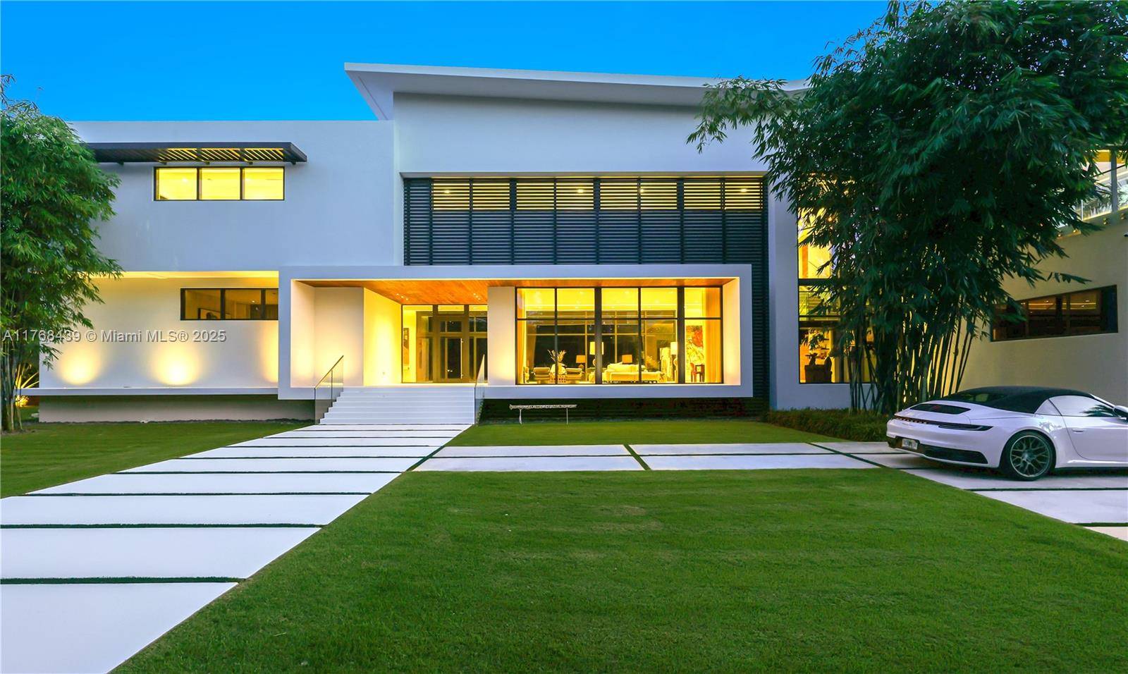 Designed by renowned architect Alberto Cordovez, this modern luxury home sits on a sprawling acre lot in the prestigious Ponce Davis neighborhood.