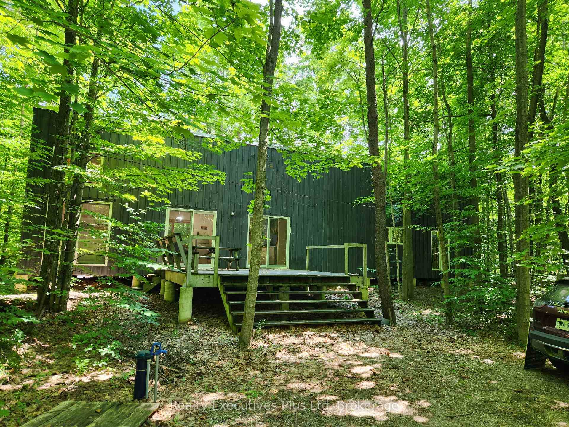 NESTLED IN THE WOODS OF BIG SAND BAY ON CHRISTIAN ISLAND, YOU WILL FIND A 2 BEDROOM, 1 BATHROOM COTTAGE WITH STORAGE LOFT THAT WAS CONCEPTUALIZED BY THE ARCHITECT TO ...