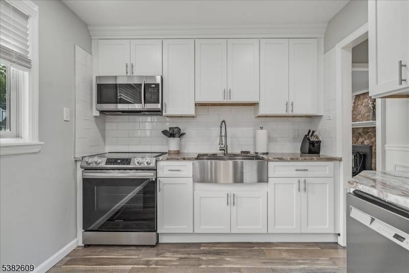 This beautifully renovated ranch blends classic charm with modern upgrades, offering effortless single level living.