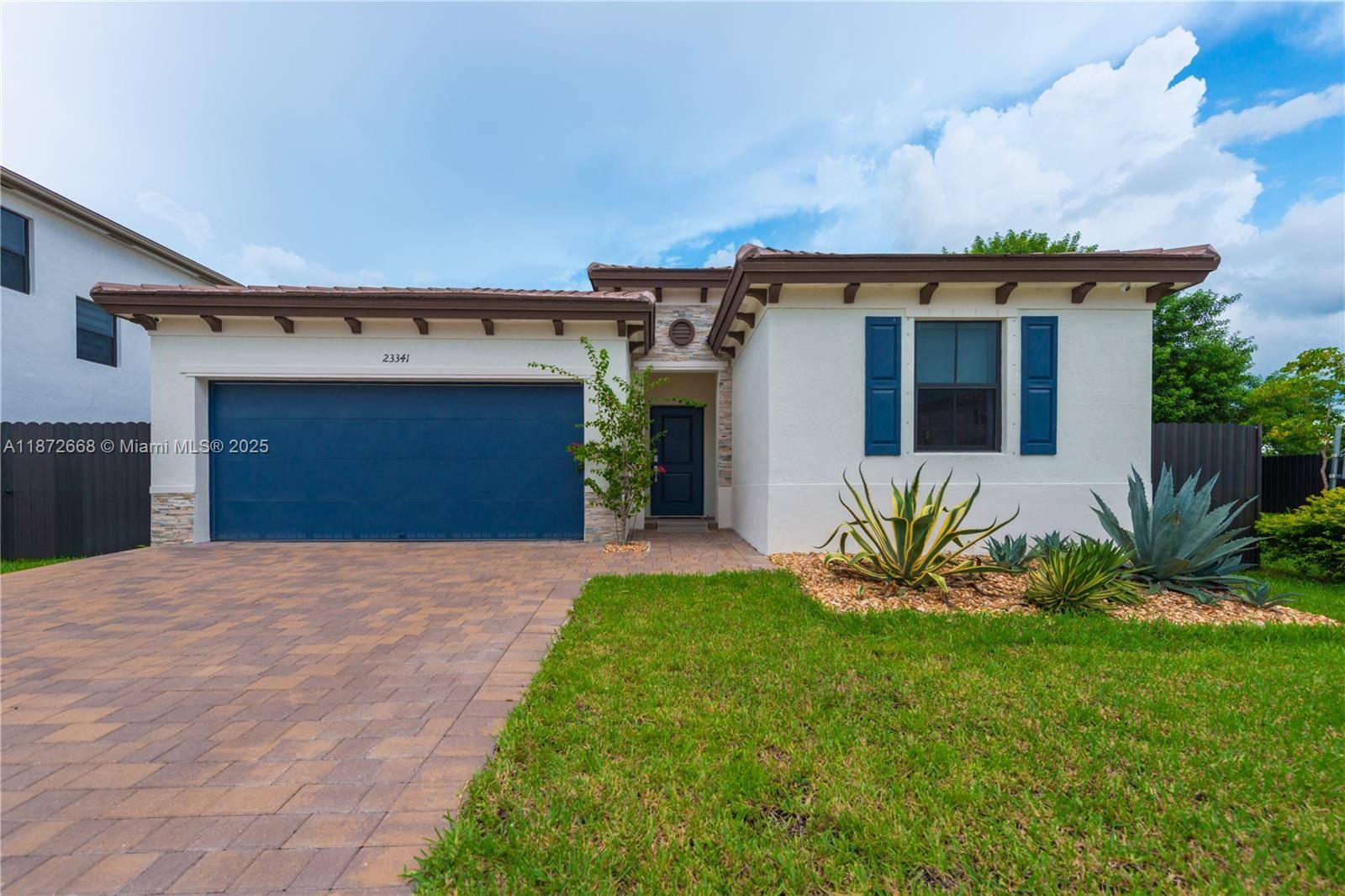 Modern 2023 residence located in the prestigious Siena Reserve community.