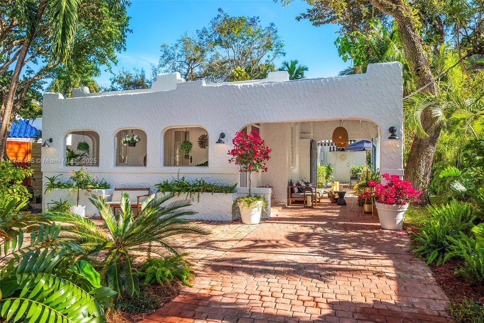 Discover this captivating gem nestled in the heart of prestigious North Coconut Grove.
