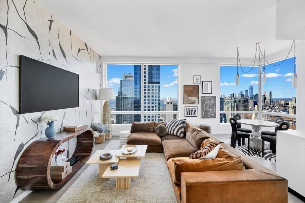 STUNNING VIEWS, 5 STAR AMENITIES AND THE LAST 25 YEAR TAX ABATEMENT Rarely available, residence 48A is a mint condition 2 bedroom, 2 bath corner home facing West and North, ...