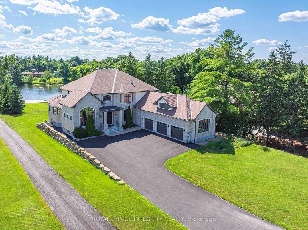Perched along the serene Rideau River, this magnificent Italian style villa seamlessly blends timeless elegance with modern luxury.