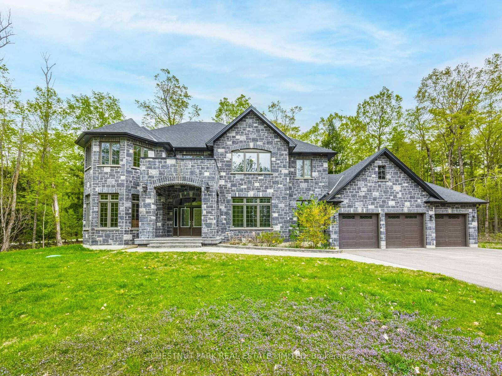 Executive family home engulfed by nature across from Lake Simcoe !