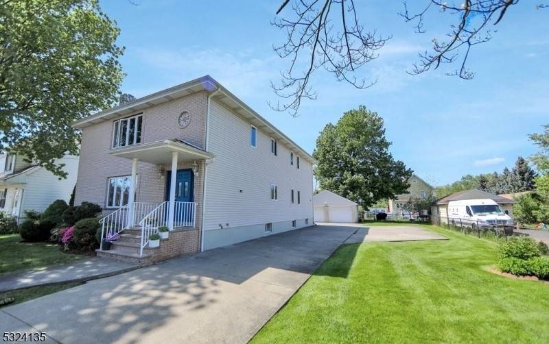 Grand Two Family home built in 2000 on an oversized lot.