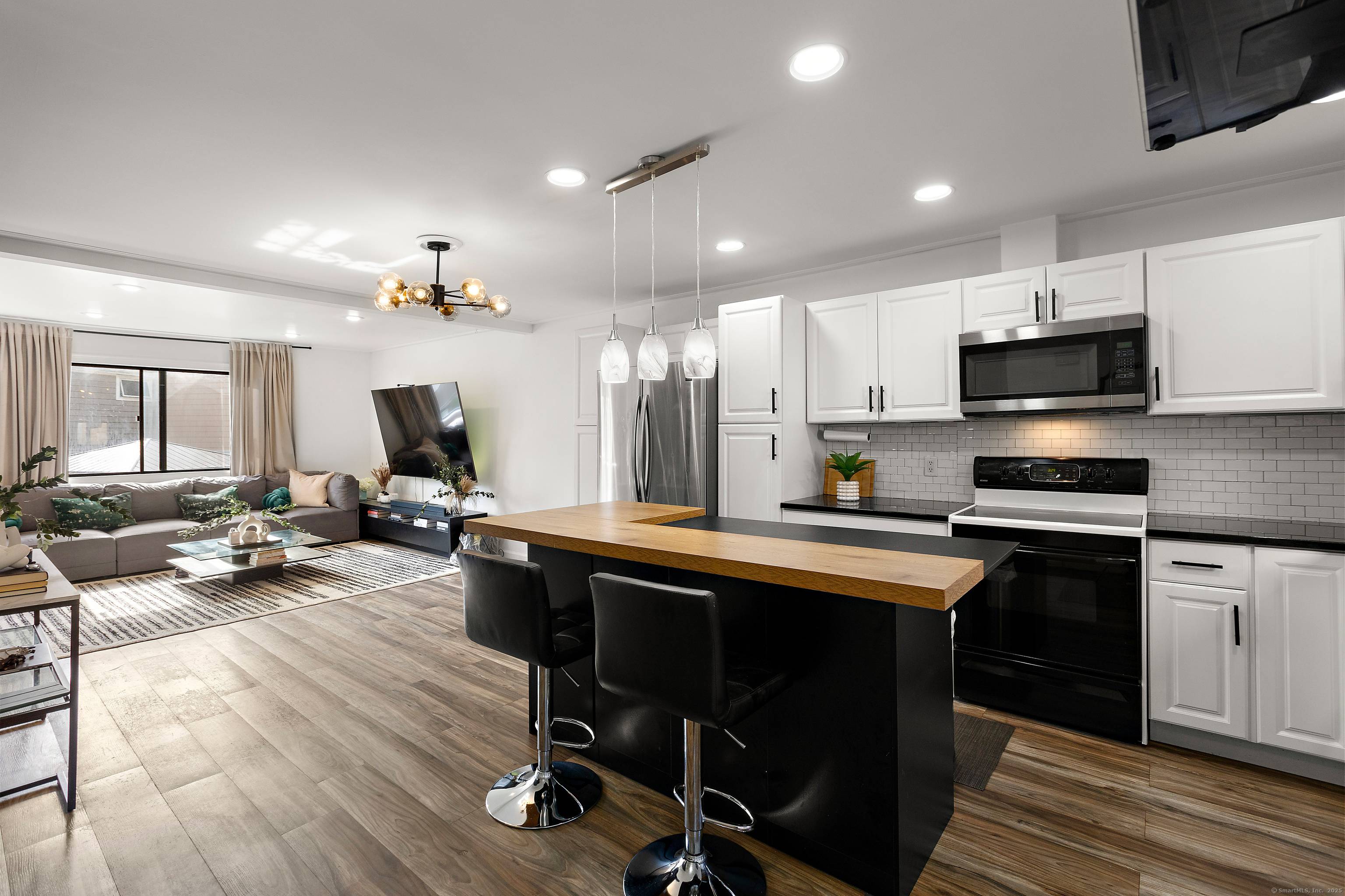 Stunning tri level townhome fully updated move in ready !