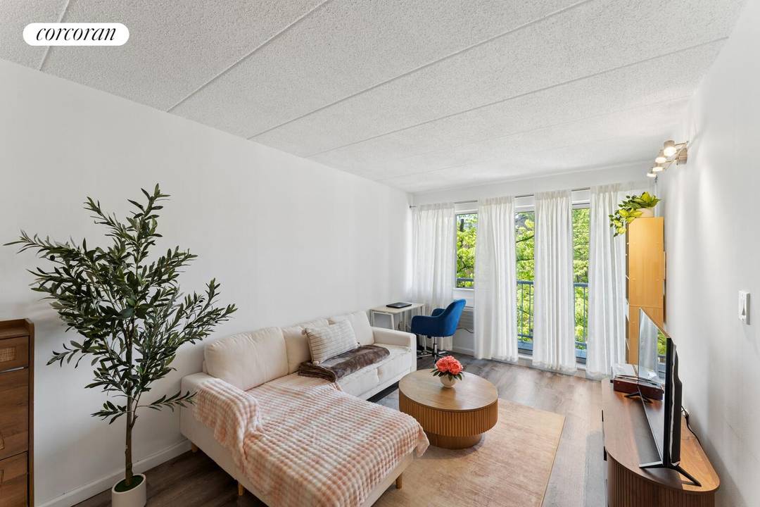 Income Producing Forest Hills Condo with Balcony amp ; Deeded Parking This meticulously renovated one bedroom condominium features an outdoor balcony and a deeded parking space.