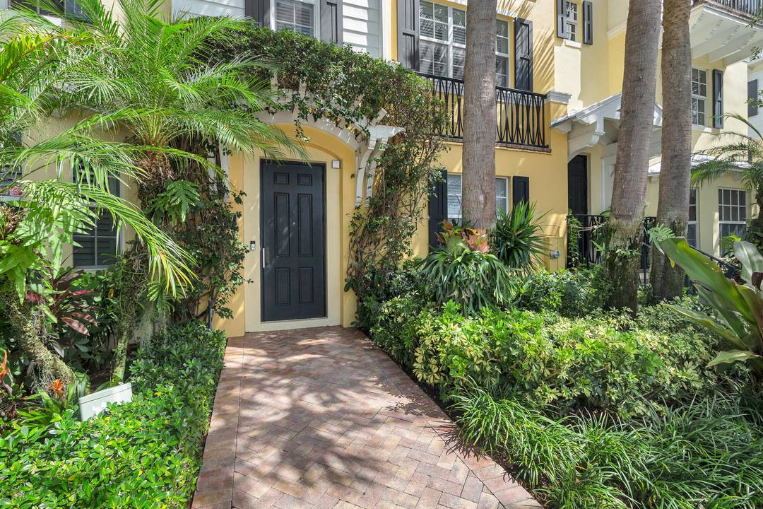 WPB's most beautiful townhouse located in highly sought after Magnolia Court.