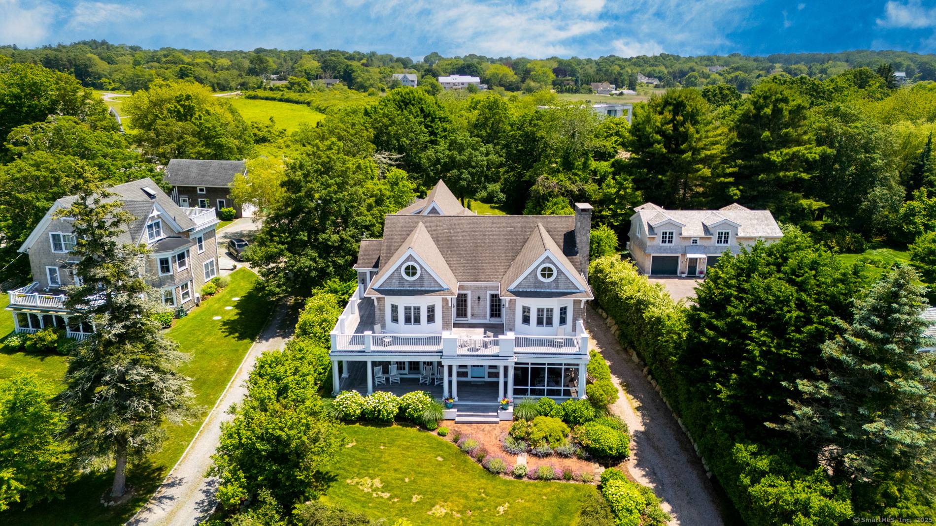 Set in the coveted summer community of Avondale just moments from the Village of Watch Hill, RI this custom built 2005 cedar shingle home offers stunning west facing views over ...