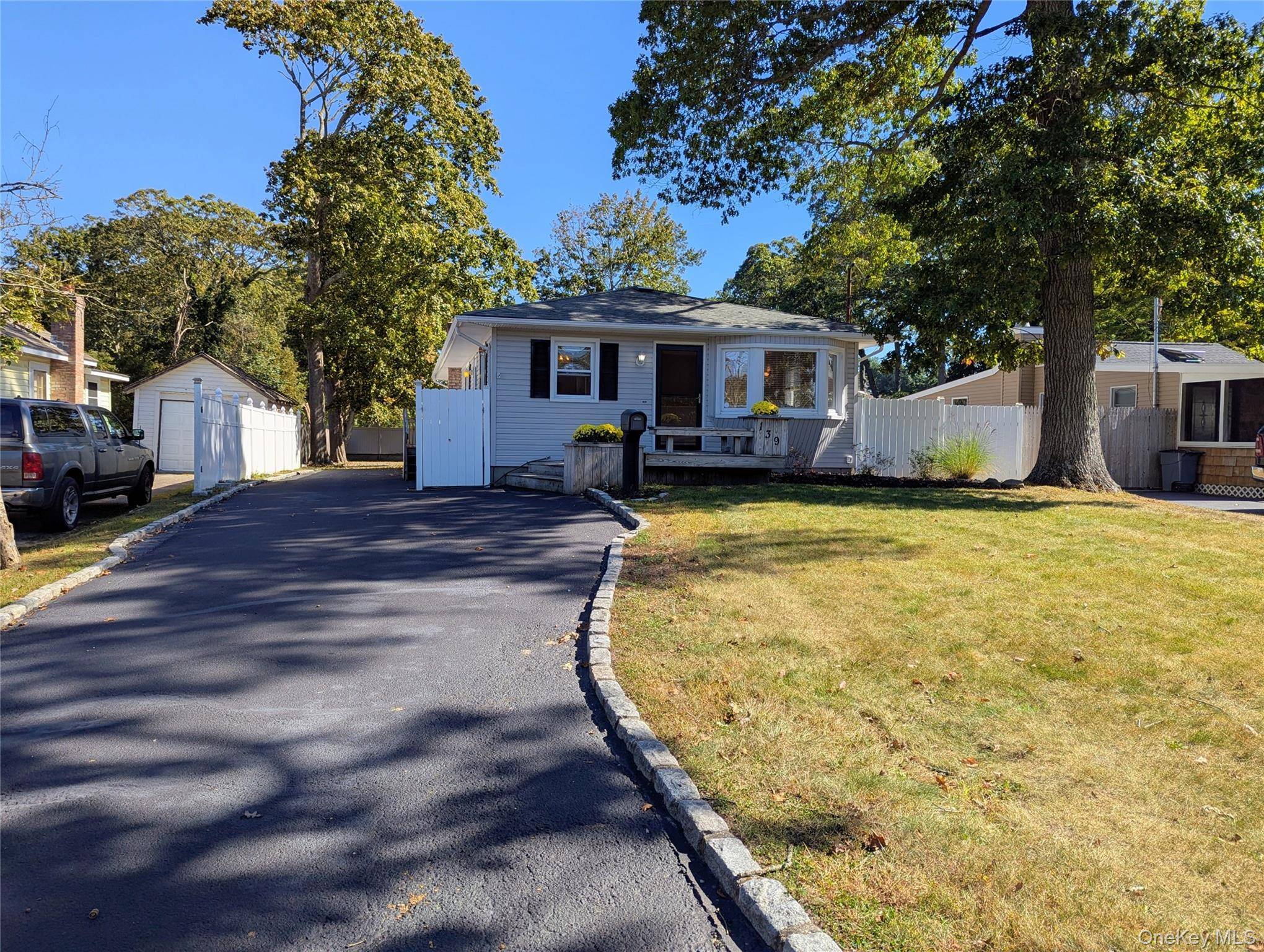 Welcome to this meticulously renovated four bedroom, two bathroom inline ranch situated in the East Patchogue area, South of South Country Road, offering convenient access to the Pine Neck Boat ...