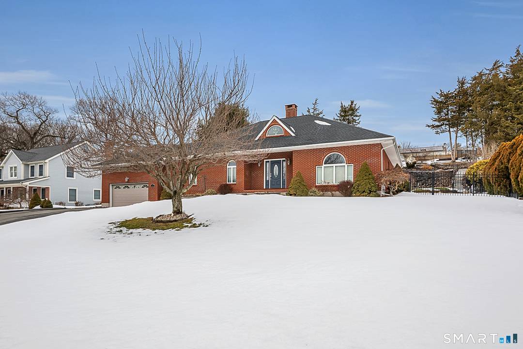 Sprawling brick ranch offers a distinctive blend of architectural character, modern updates, and exceptional entertaining spaces.