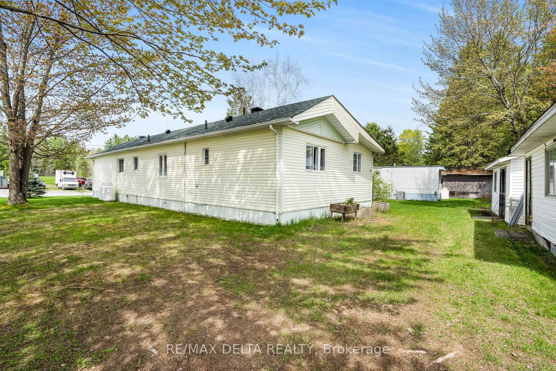 Welcome to this charming and spacious mobile home located in the sought after Domaine du Village in Rockland, set on a desirable corner lot.