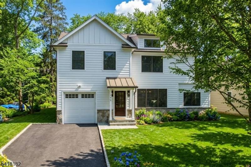 Welcome to this stunning new construction home, perfectly situated on a coveted, tree lined street in one of Chatham's most desirable neighborhoods.