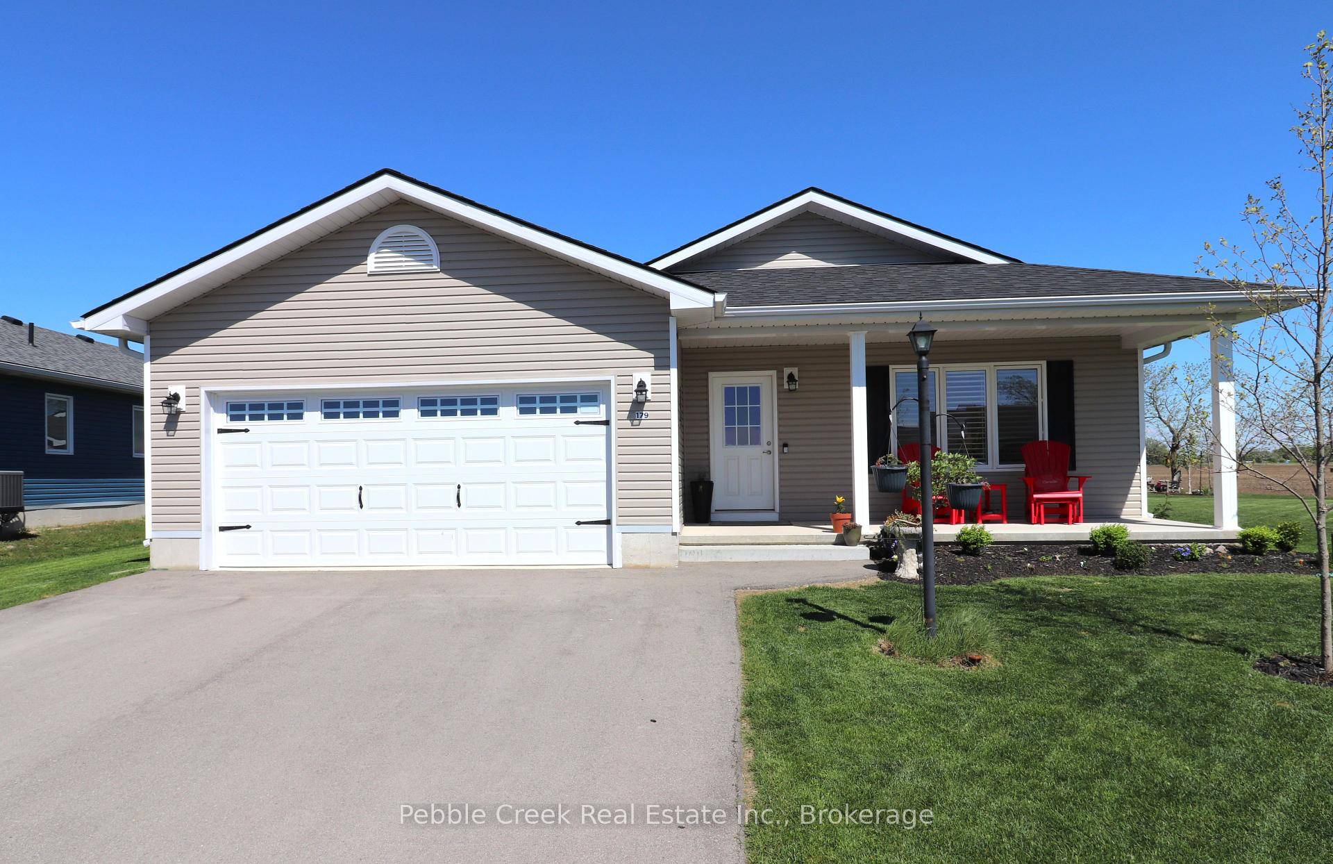 Amazing location ! This fabulous 1595 sq foot Cliffside B with sunroom model is located on a premium outside lot in the very desirable Bluffs at Huron !