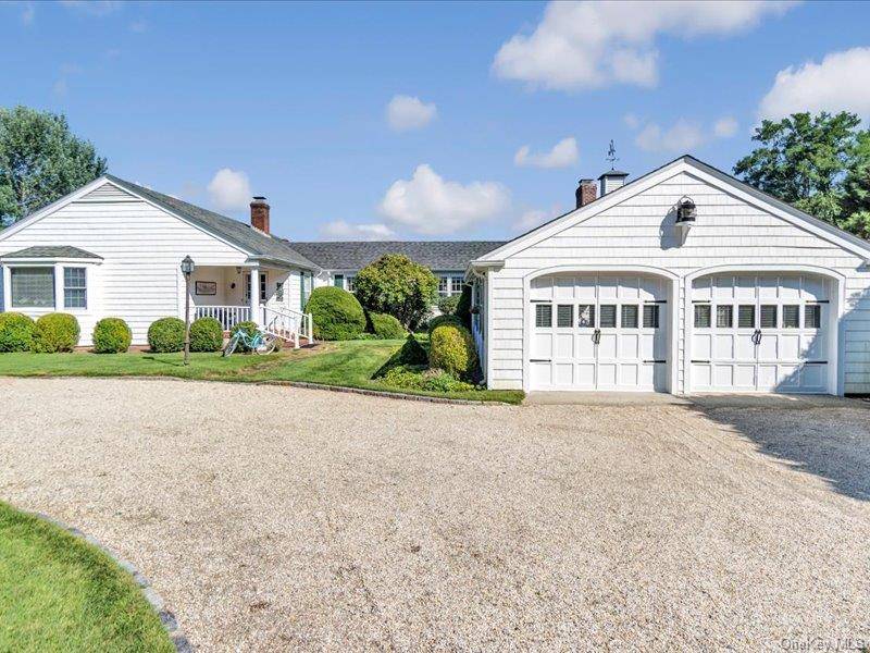 Just a short stroll from Main Street sits this charming expanded bayfront ranch offering 4 bedrooms and 3 baths, Enter a light filled living room with fireplace leading to an ...