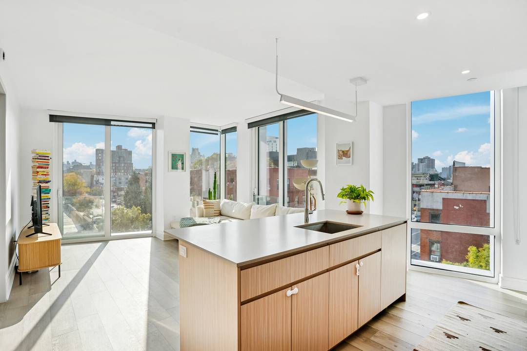 Spacious and sun filled, this two bedroom, two bathroom corner residence offers double exposure, floor to ceiling windows, and generous closet space throughout.