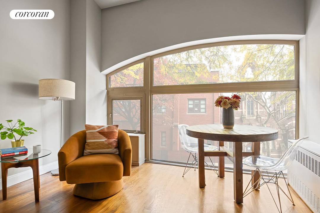 In the heart of Brooklyn Heights, this elegant oversized one bedroom residence radiates charm and character, framed by historic arched windows and delightful views.
