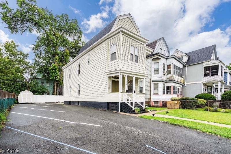 Renovated Two Family home situated on a double lot in a desirable East Orange residential neighborhood !