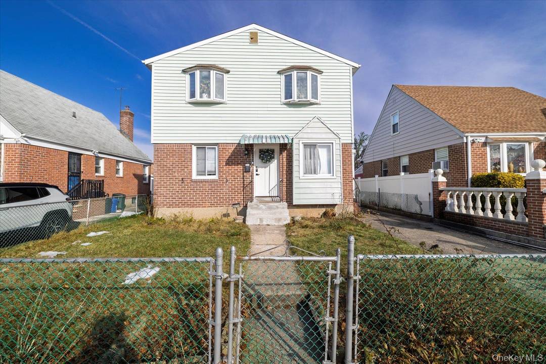 This expansive single family residence is located on a quiet, tree lined block in the heart of Queens Village.