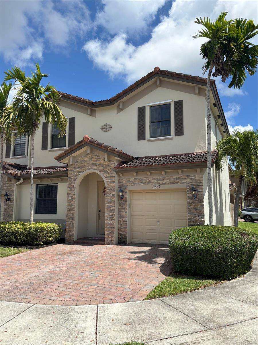 Rarely available 4 bedroom corner townhouse with 2.