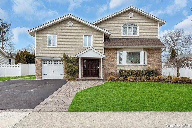 Beautiful, big split level home located in the center of the renowned Jericho School District.