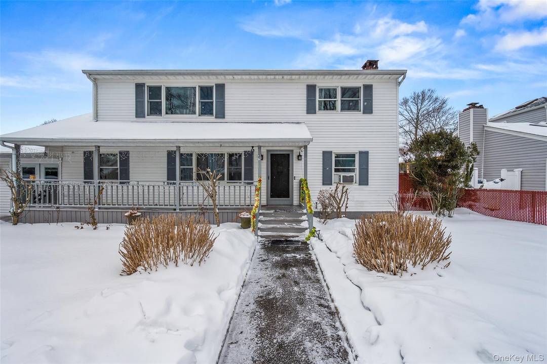 8 George Drive offers five bedrooms and three full bathrooms with exceptional space and versatility.