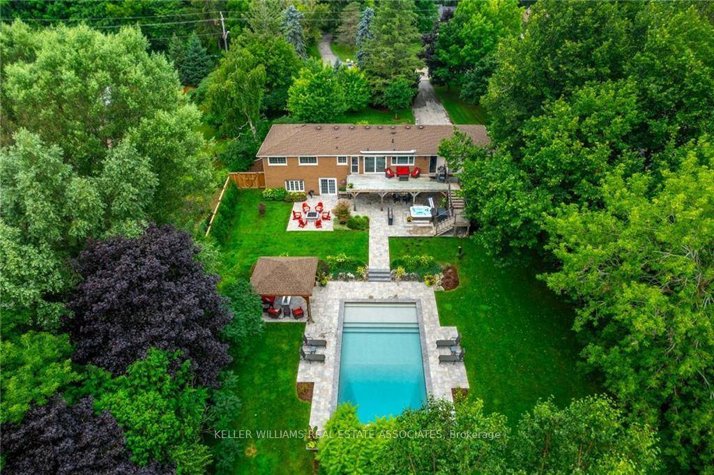 Welcome to 338 Carlisle Road, a charming bungalow nestled on a serene 2 acre lot in Carlisle.
