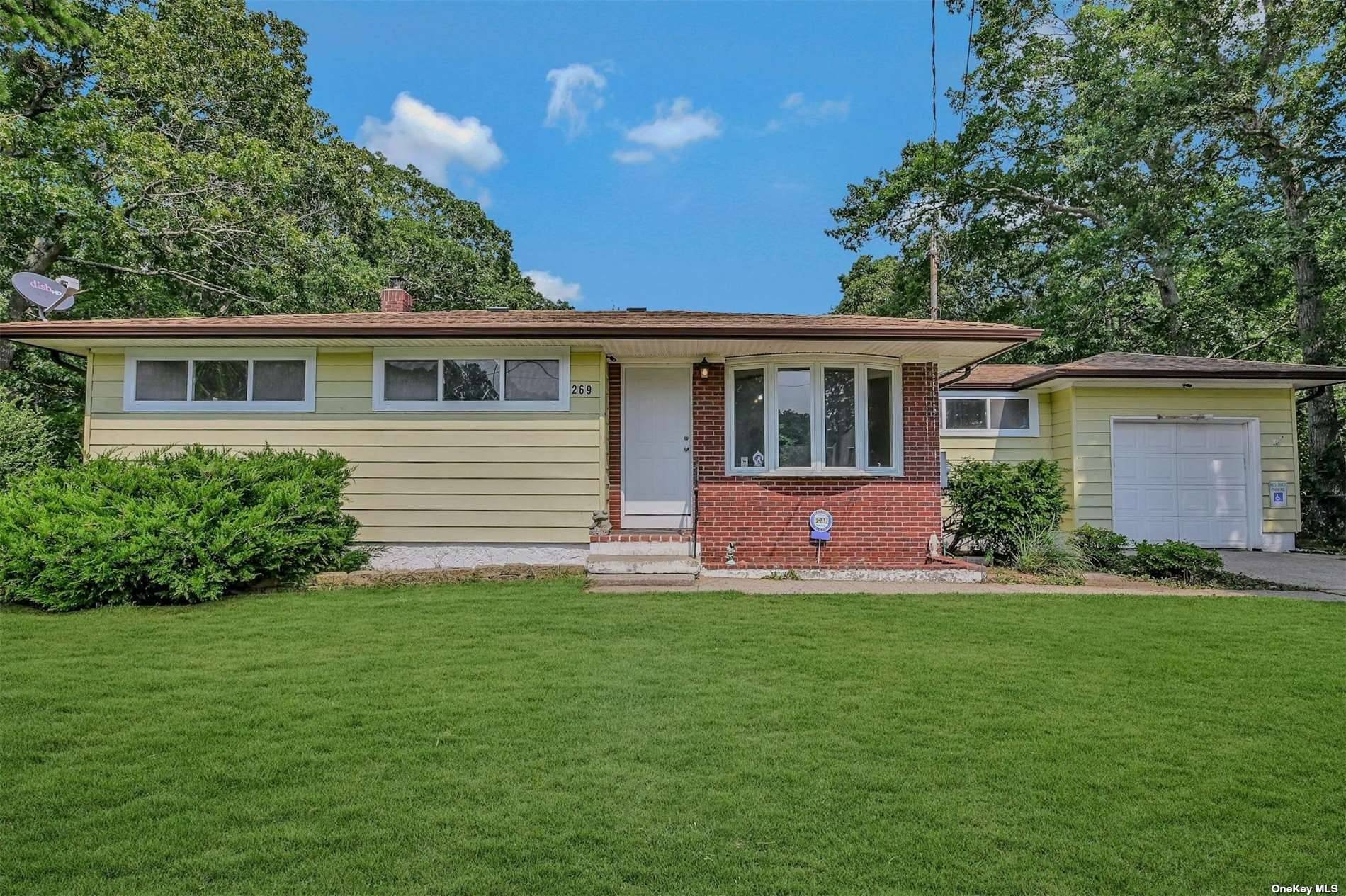 Welcome to your ideal starter home in Mastic, New York, where charm meets value !