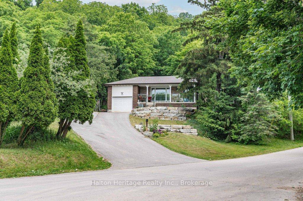 Nestled on a rarely offered, dead end street in one of Dundas' most sought after neighborhoods, this exceptional property combines privacy, space, and natural beauty in a truly unique setting.