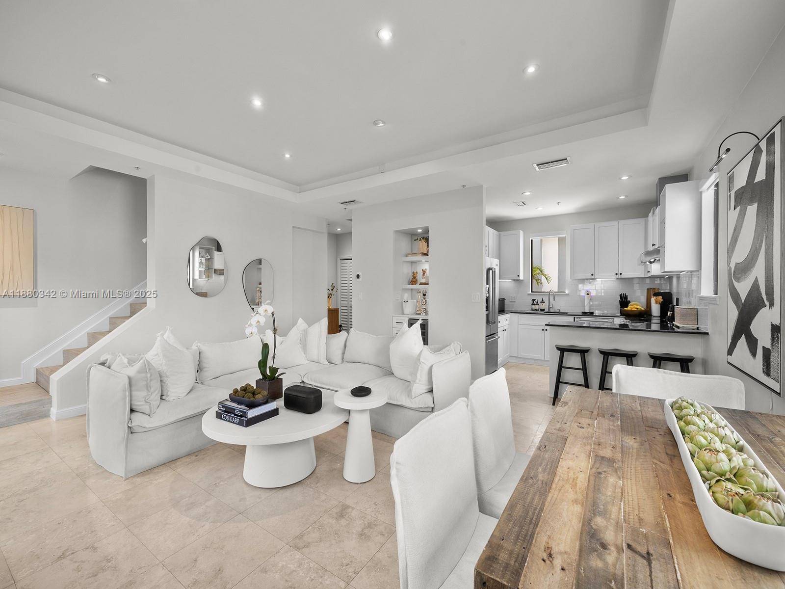 Discover this elegantly crafted 3 story townhome in the sought after neighborhood of South Miami, east of US1.