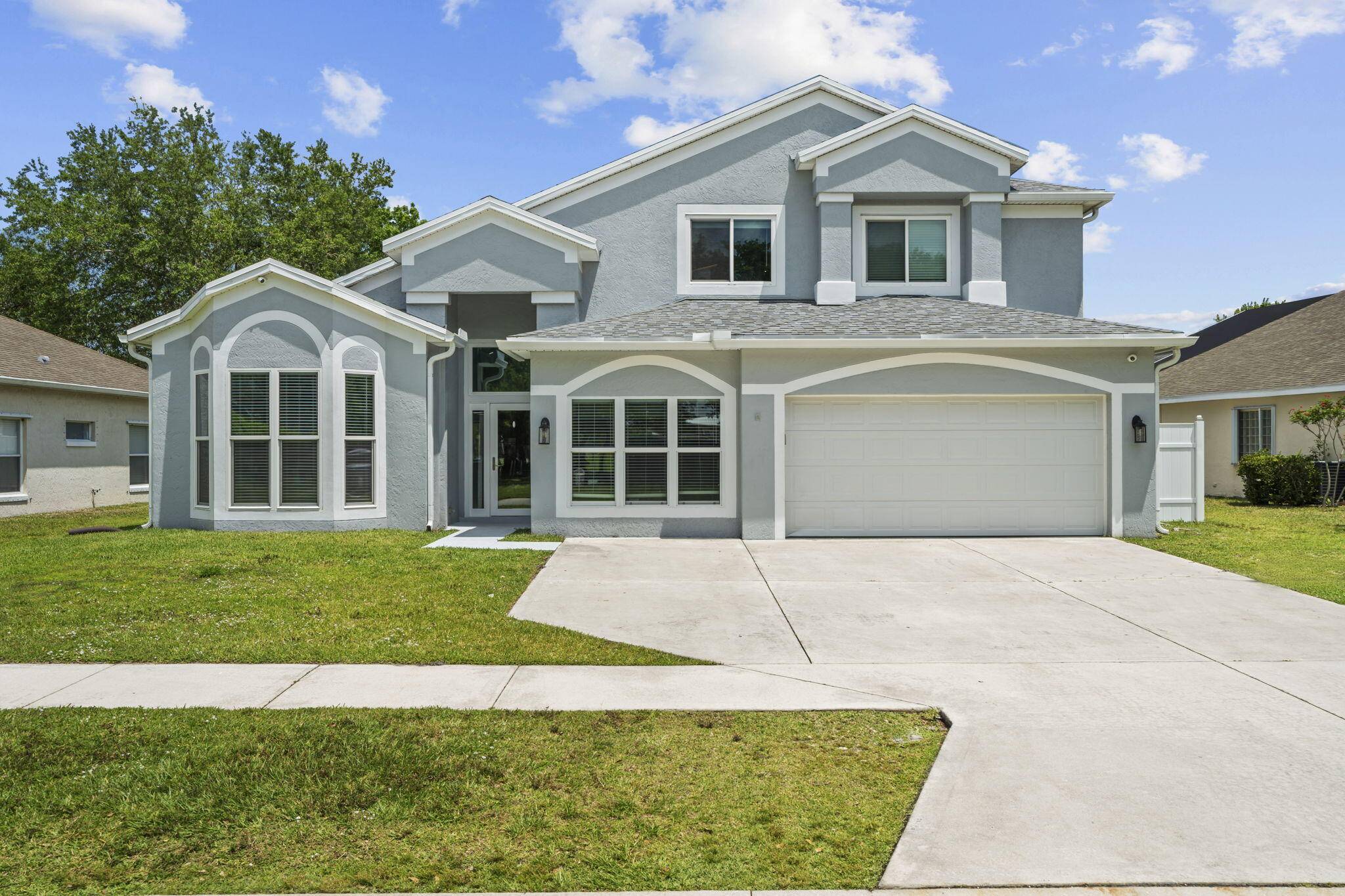 Experience luxury and peace of mind in this renovated 5bed 4bath smart home in the heart of Palm City.