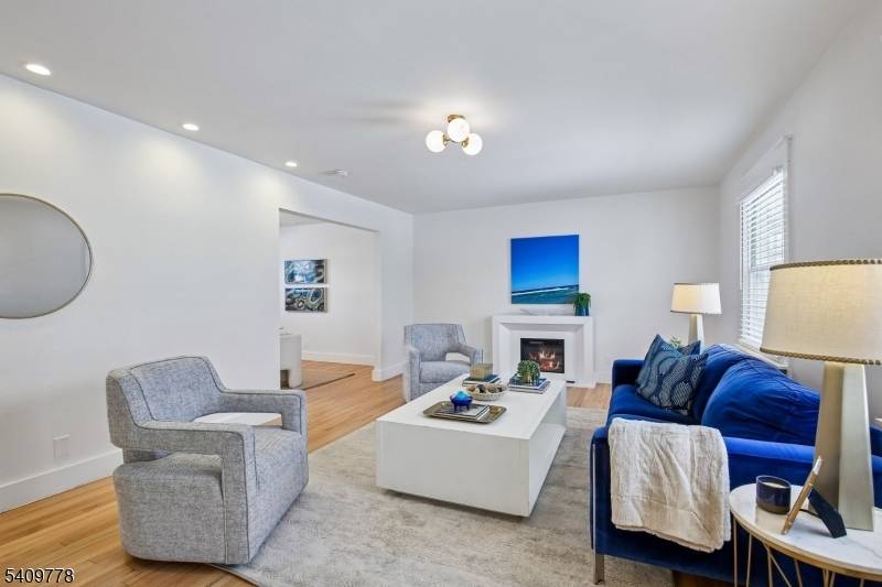 Set on nearly 1 3 of an acre, on a quiet street, this stunning home offers light filled rooms arranged in a spacious, flowing floor plan.