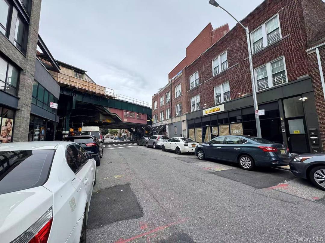 Heart of Woodside ! Solid brick mixed use building just next to the 7 train station.