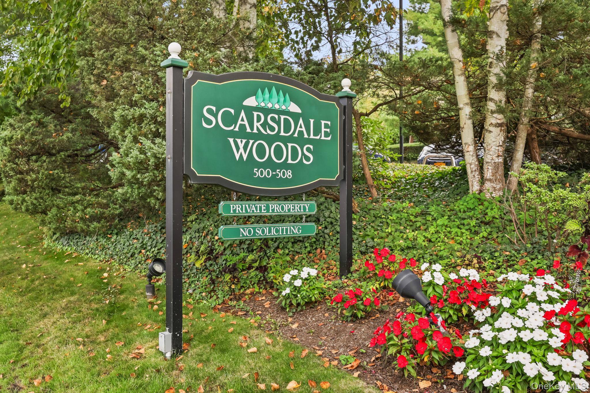 Welcome to Scarsdale Woods in Edgemont a serene community with landscaped grounds, lush green lawns, and walkways.