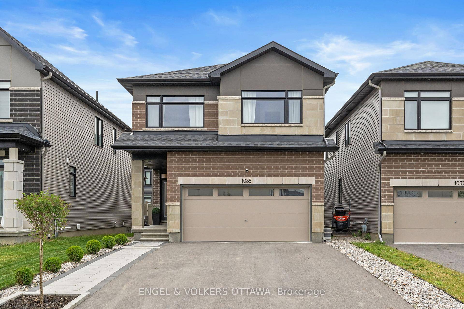 Elegant home with many upgrades including fixtures and feature walls with a double car garage in sought after Riverside South.