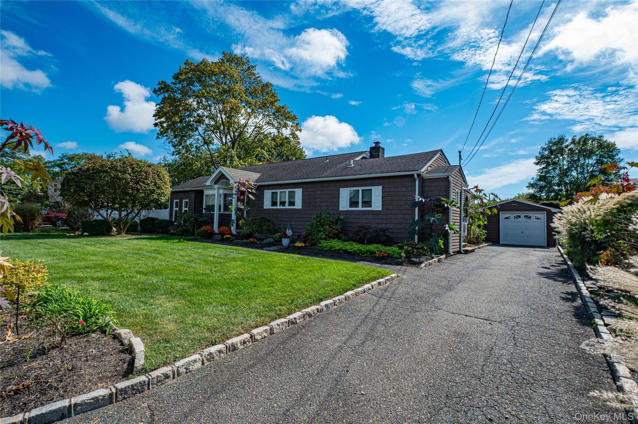 Welcome to this beautifully maintained single family sprawling ranch nestled on a 107x100 lot in desirable North Babylon.