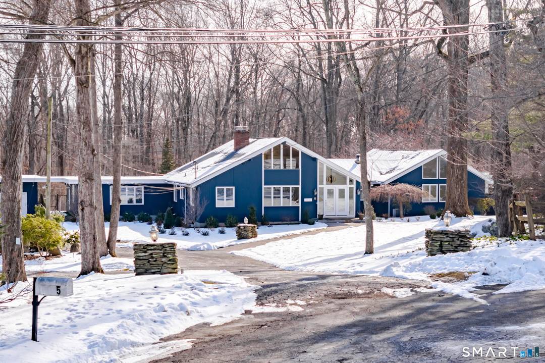 Stunning custom contemporary ranch tucked at the end of a quiet cul de sac !