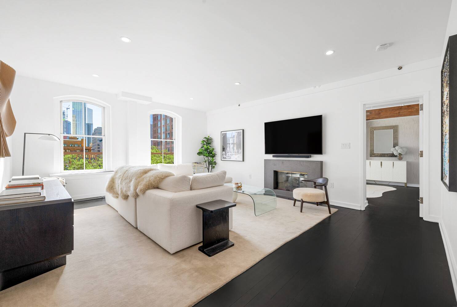 Sophisticated and sun drenched, this impeccably designed quintessential Tribeca loft at the famed Grabler Building offers breathtaking open views and striking architectural details.