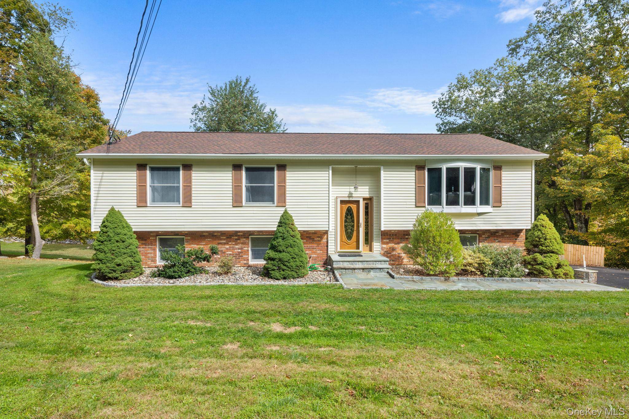 A spacious move in ready raised ranch, nestled in a parklike setting, awaits its new owners.