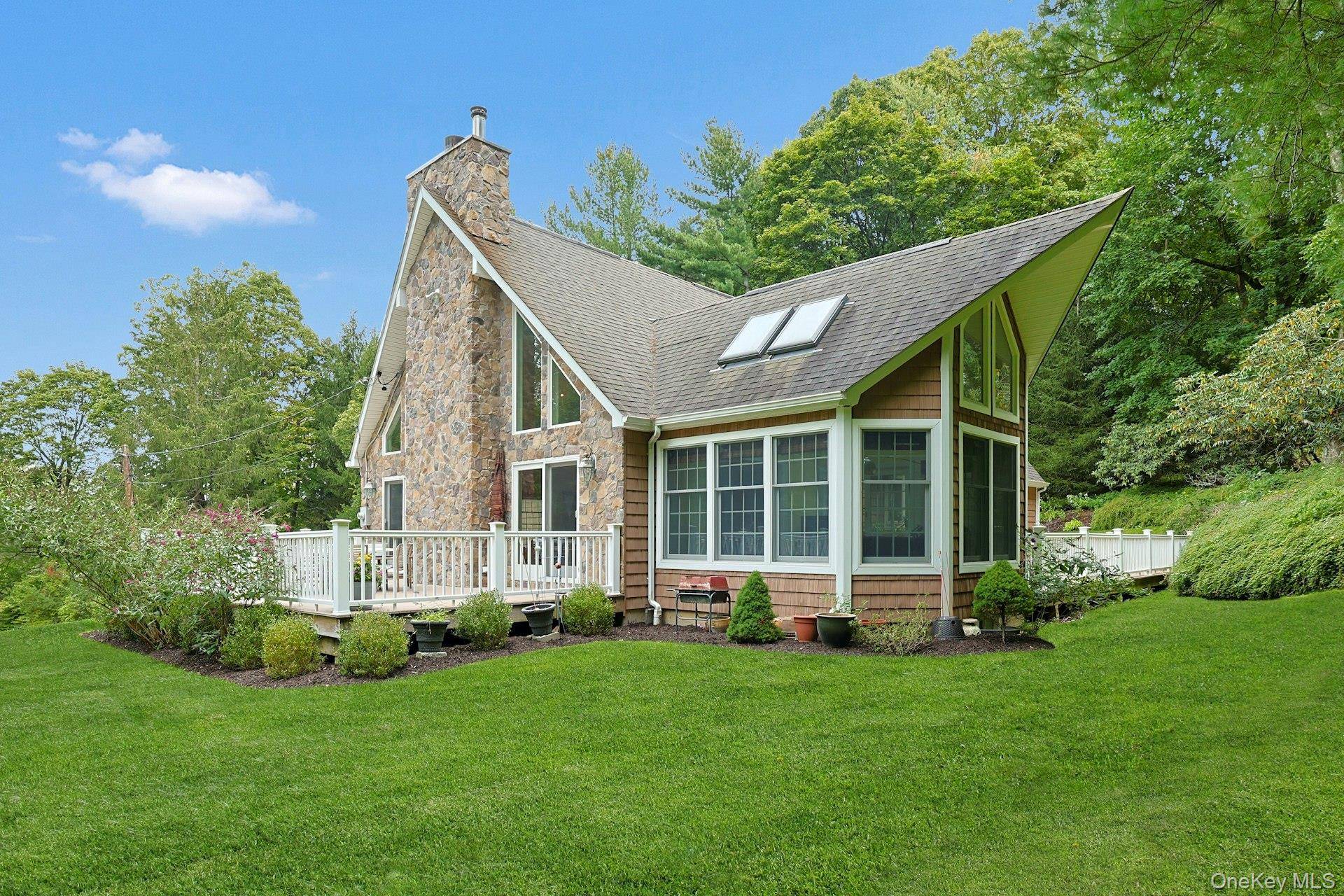 Chappaqua Schools ! This immaculately maintained 3 bedroom stone and shingle Colonial is gracefully sited on nearly an acre of professionally landscaped grounds, offering exceptional privacy and tranquility.