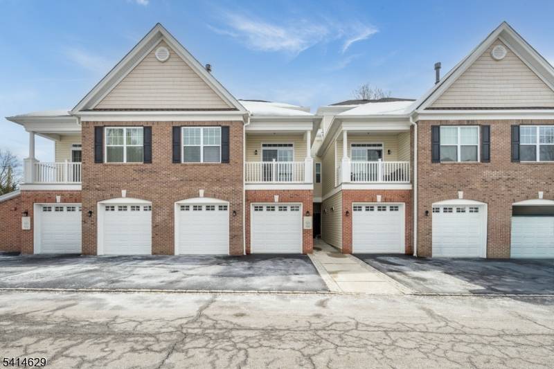 MOVE IN READY LITTLE FALLS CONDO WITH OPEN FLOOR PLAN NUMEROUS UPGRADES !