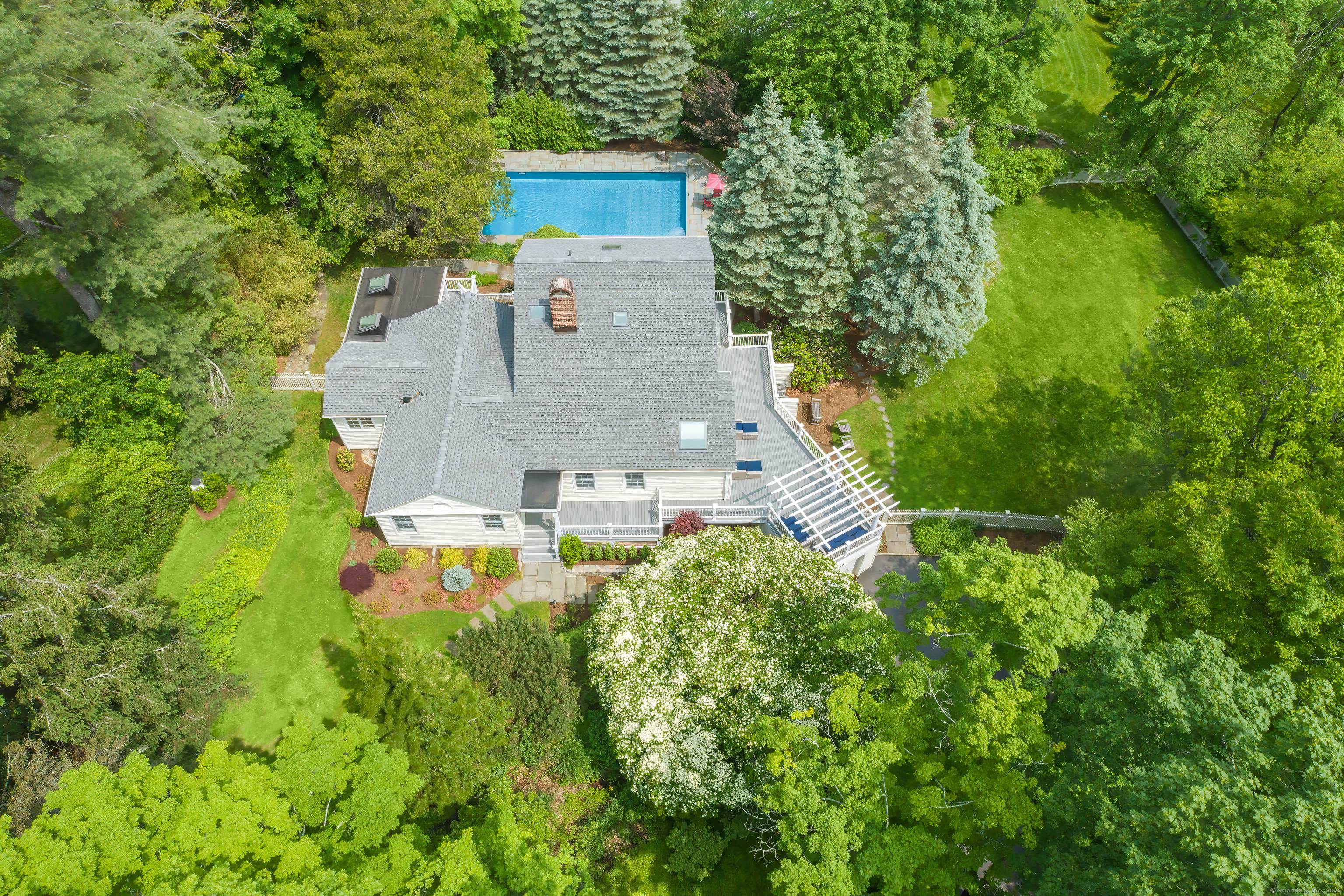 Prime Main Street Location Stunning transitional style Cape Cod residence tucked down a private lane in one of Ridgefield's most desirable in town locations.