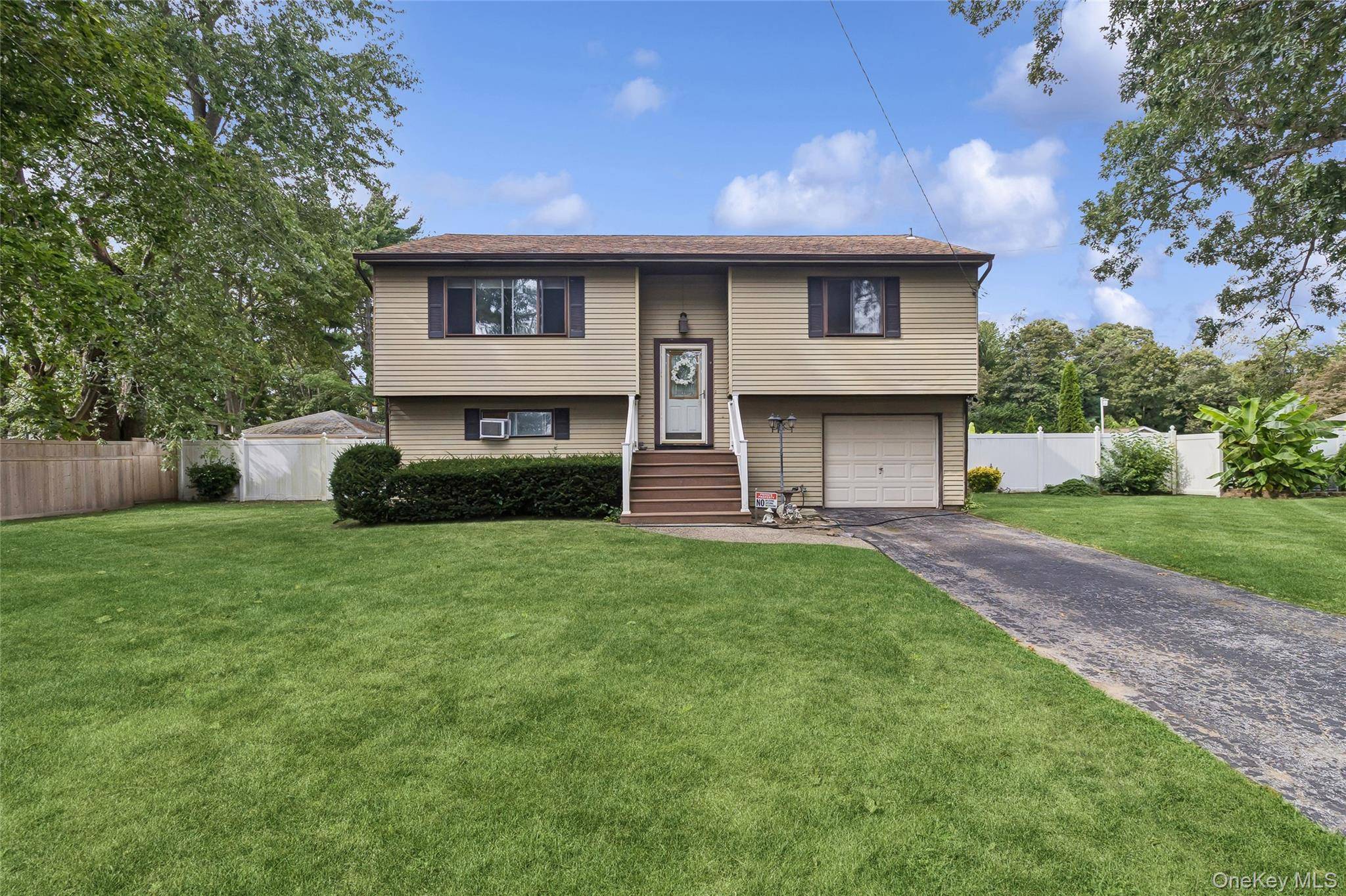 Welcome to this Spacious Hi Ranch located on just shy Half Acre.
