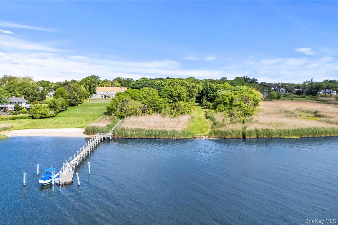 A Rare Waterfront Opportunity in the Heart of Bellport Village Nestled along the serene shores of Bellport Bay and just moments from the village s charming downtown, this extraordinary offering ...
